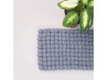 Top view of textured grey wool felt ball cat mat