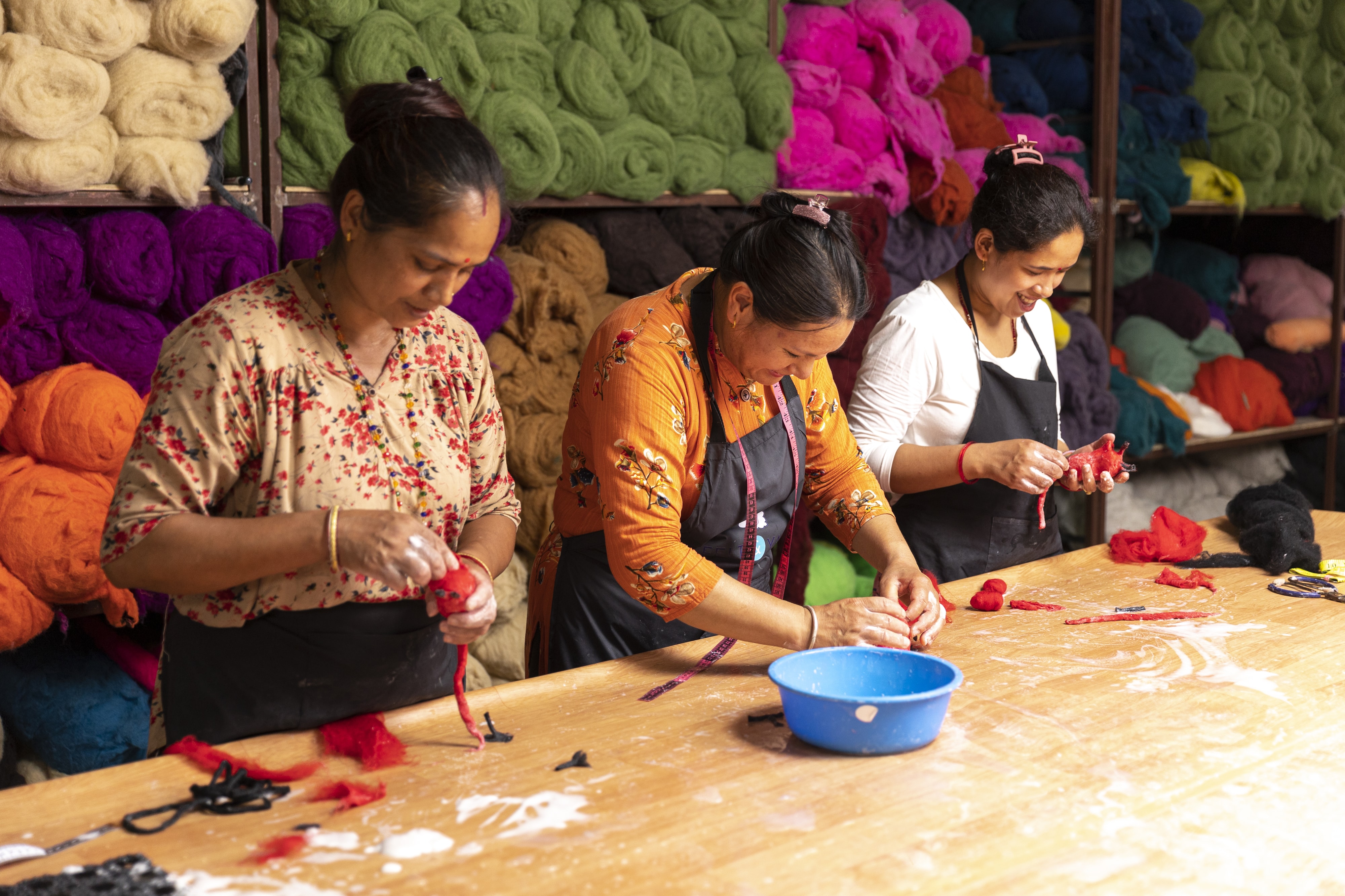Skilled artisan making handmade wool felt pet toys in Nepal